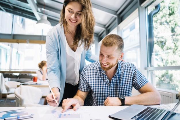 smiling-colleagues-making-notes-on-plans_23-2147707721 smiling-colleagues-making-notes-on-plans_23-2147707721
